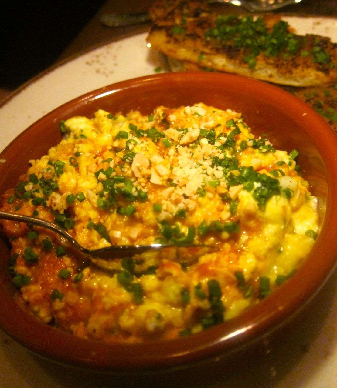Must-have scrambled eggs with romesco and Boucheron to pile on tomato confit toast.